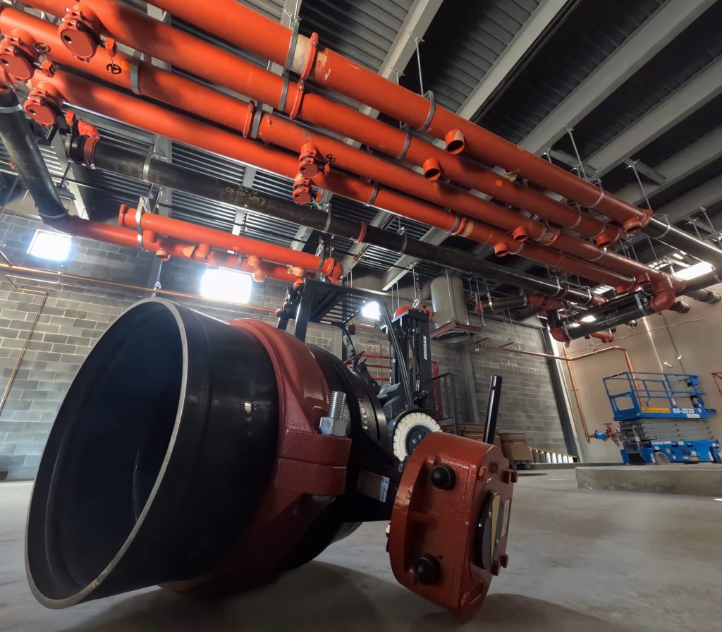 Picture of orange and black piping within a facility
